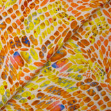 Lin viscose imprimé écailles ensoleillées orange et jaune fond écru