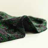 Punto de cadeneta de lúrex verde y morado