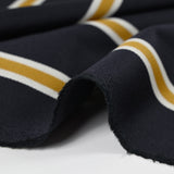 Gabardine de laine mélangée rayée écru et moutarde fond marine