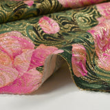 Golden brocade with pink flowers green background