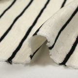 Jersey de coton flammé pointelle rayé noir et blanc cassé