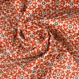 Double-sided quilted cotton flowers and brown arabesque per meter