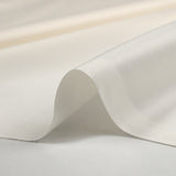 Popeline de coton satinée blanc cassé