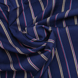Woven viscose dyed red striped navy background