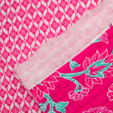 Coton matelassé double face fleurs fuchsia et vert au mètre
