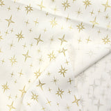 Popeline de coton imprimée étincelle doré fond blanc