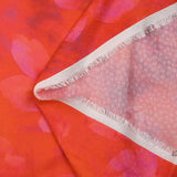 Jacquard de viscose satiné imprimé taches florales fond orange