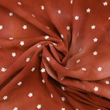 Crépon viscose brodé petites fleurs fond tie & dye brique