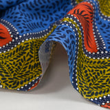 Coton imprimé ethnique Almelo bleu, orange et jaune