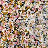 Viscosa estampada con flores de Ornella mostaza, rosa y celeste.