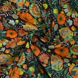 Coton imprimé pluie de fleurs orange fond marron