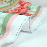 Orange and green vitamin pride cotton