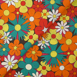 Algodón con estampado de flores disco en rojo, naranja y turquesa