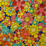 Coton imprimé flower power corail fond bleu roi