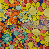 Coton imprimé flower power corail fond bleu roi