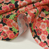 Cotton printed cherry blossoms coral pink black background