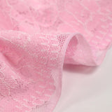 Dentelle fleurs des champs fond rose