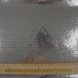 Silver sequins on gray tulle