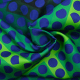 Gabardine de laine mélangée imprimée gros pois bleu fond vert