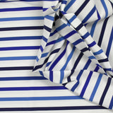Jersey de polycoton marinière nuances de bleu fond blanc