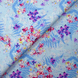 Popeline de coton imprimée l'ombre des fougères fond bleu layette