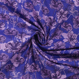 Popeline de coton imprimée silhouette en fleurs lilas fond indigo