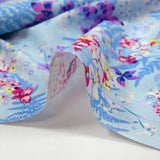 Popeline de coton imprimée l'ombre des fougères fond bleu layette