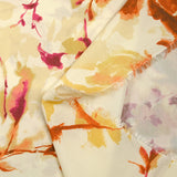 Viscose imprimée encre de fleurs orange et jaune fond écru