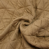 Jersey matelassé triangle fond beige foncé