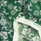Popeline de coton imprimée pampille de Noël fond vert