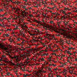 Popeline de coton imprimée arabesque fond rouge