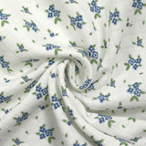 Jersey de coton matelassé imprimé fleurettes bleu fond blanc