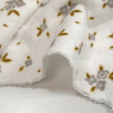 Jersey de coton matelassé imprimé fleurettes gris fond blanc