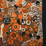 Viscose jersey printed field of orange and brown flowers on beige background