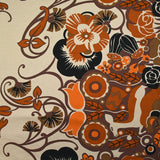 Viscose jersey printed field of orange and brown flowers on beige background