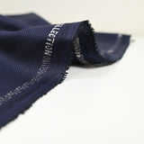 Tissu tailleur laine mélangée texturé marine