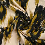 Printed viscose mystical leaves ocher beige background