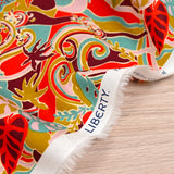 Coton liberty ® Elea Sun rouge et moutarde au mètre