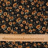 Dentelle imprimée fleurs camel fond noir