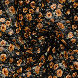 Dentelle imprimée fleurs camel fond noir