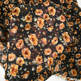 Dentelle imprimée fleurs camel fond noir