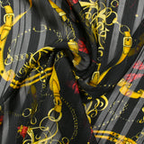 Printed muslin, satin band, chains and tassels, black background