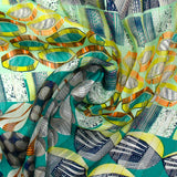 Mousseline imprimée bande satin galets de mer turquoise et vert d'eau