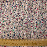 Mousseline imprimée bande satin fleurs vagabondes fond rose poudré