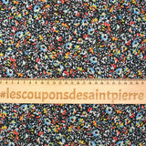 Mousseline crinkle imprimée irisée miette de fleur fond noir