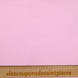 Cotton stung printed with polka dot pink background