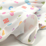 Piqué de coton imprimé alphabet