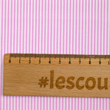 Polycoton rayé rose 1mm fond blanc