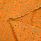 Beige scalloped English embroidery Éléonore orange background