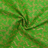 Broderie anglaise festonnée beige Éléonore fond vert pomme